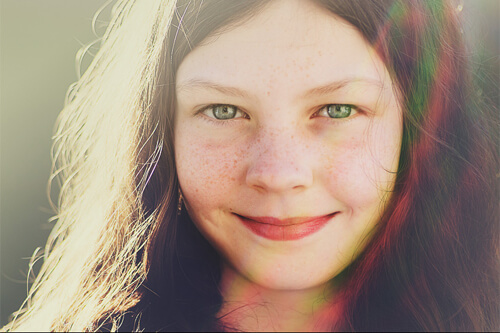 a girl smiles at the camera