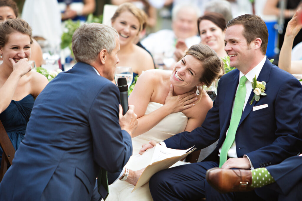 wedding couple during speech featured artist