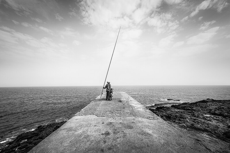 black and white fisherman