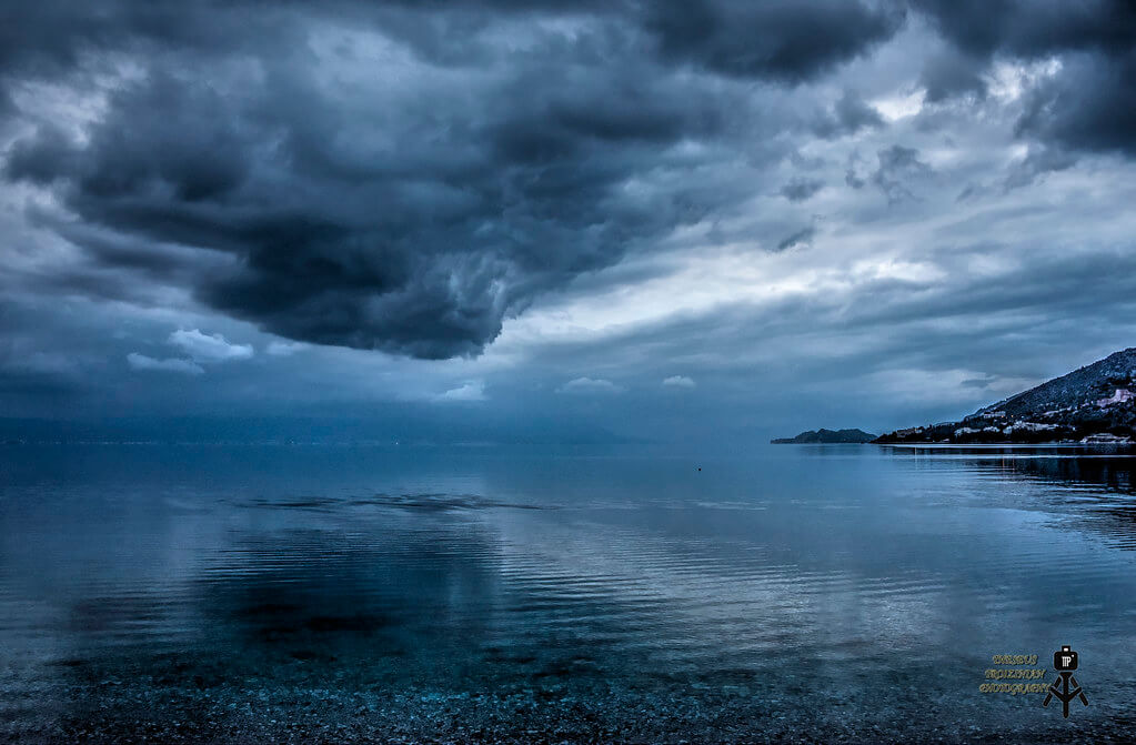 Theseus Troizinian - storm cloud over water