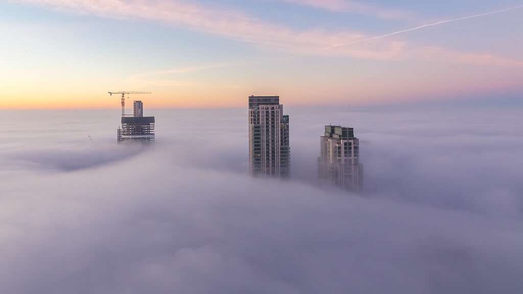 Paul Shears - skyscrapers above clouds