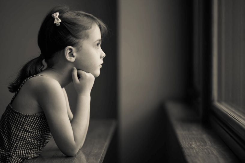 child looking out window